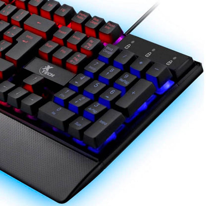 Teclado Gaming Xtech XTK-510S con iluminación LED multicolor, diseño QWERTY en español y descansa-palmas integrado.
