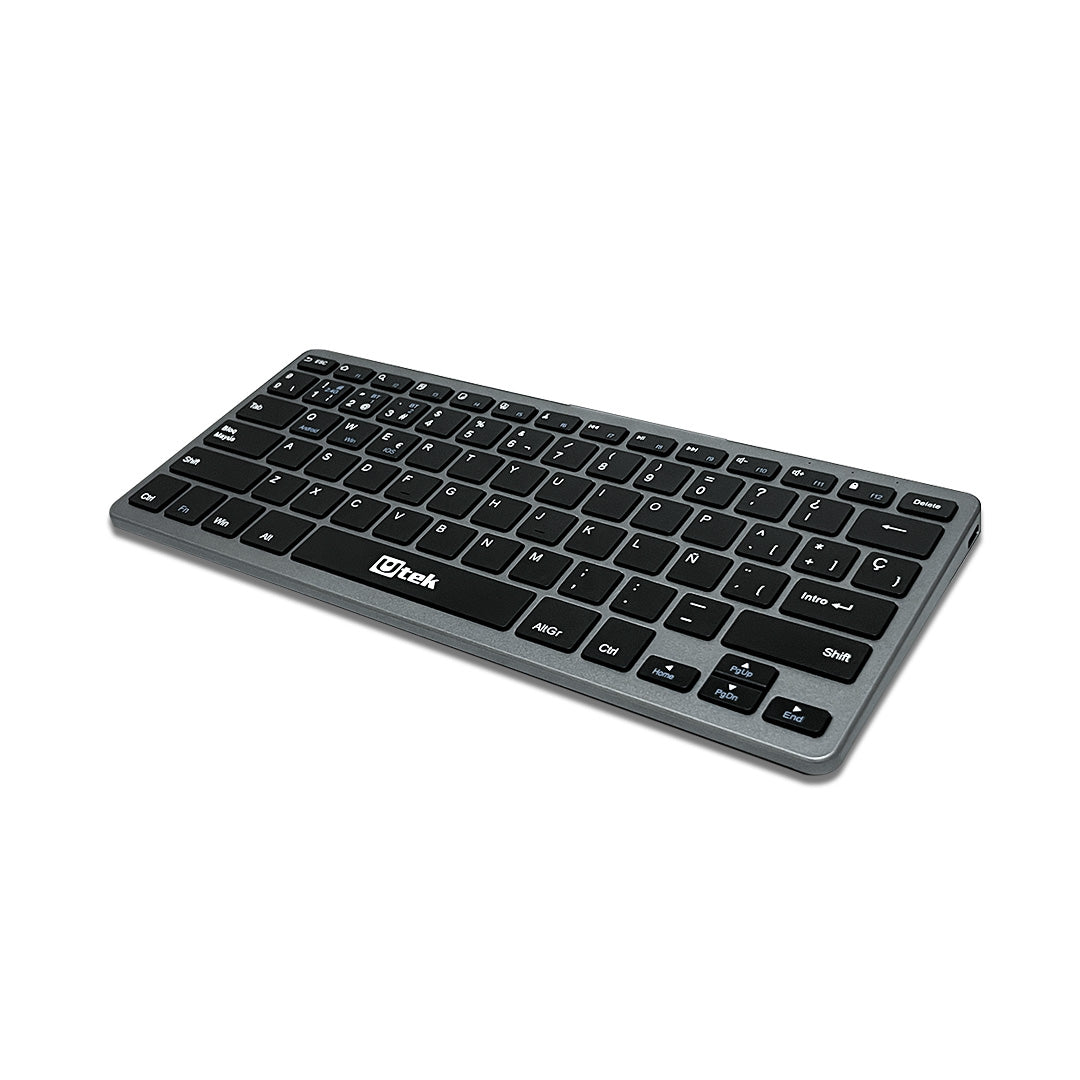 Teclado inalámbrico UTEK UT-KBBT2100 con conectividad Bluetooth y 2.4GHz, diseño recargable y portátil.
