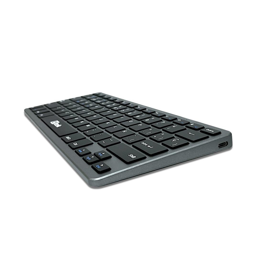 Teclado inalámbrico UTEK UT-KBBT2100 con conectividad Bluetooth y 2.4GHz, diseño recargable y portátil.
