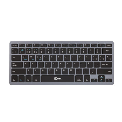 Teclado inalámbrico UTEK UT-KBBT2100 con conectividad Bluetooth y 2.4GHz, diseño recargable y portátil.
